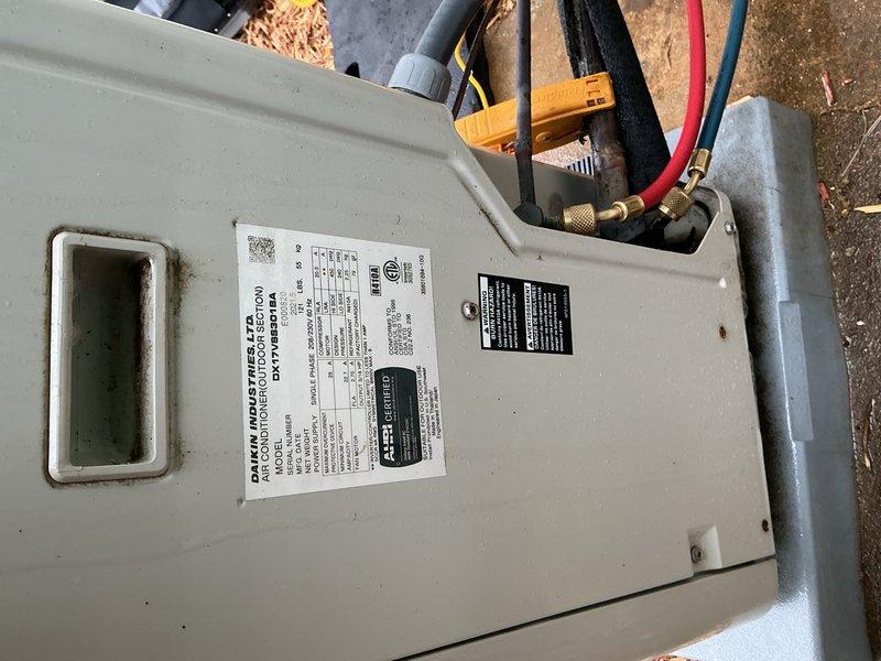 Completed comprehensive cooling season tune-up on a Daikin ground-level condensing unit less than 10 years old located in side yard. Performed full system inspection including electrical control board evaluation, verified proper wiring connections and relay operation, inspected refrigerant line connections and fittings for integrity, and documented equipment nameplate data and operational specifications. All components found operating within normal parameters with system ready for cooling season operation.