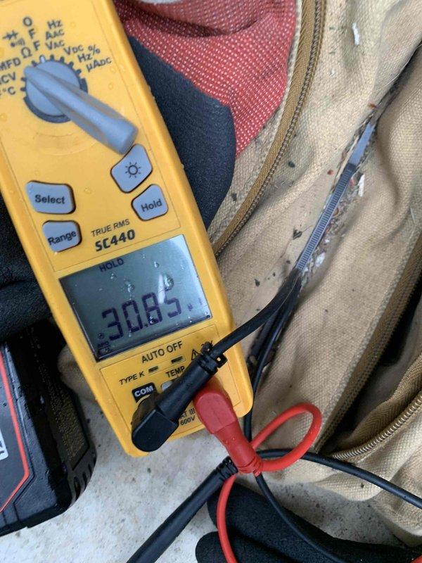 Completed comprehensive cooling system tune-up on single outdoor AC unit. Performed standard maintenance protocol including electrical testing with digital multimeter, which confirmed proper voltage readings at 30.85V. Unit is readily accessible and all components were inspected, tested, and verified to be operating within manufacturer specifications.
