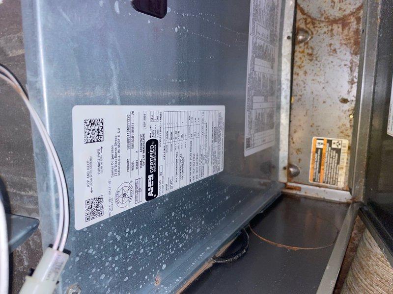 Completed preventative maintenance tune-up on single outdoor AC condenser unit per Home Depot service agreement. Performed standard inspection of exterior unit showing significant weathering and dirt accumulation on casing and top grille, as well as indoor air handler components displaying rust staining on cylindrical sections. System operational at time of service with routine maintenance procedures completed on both outdoor and indoor HVAC equipment.