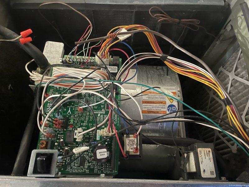 Completed comprehensive cooling system tune-up on basement-located O10 unit. Performed standard maintenance protocol including inspection of capacitor, electrical connections, control boards, and all associated wiring components. All systems tested and verified operational, with photographic documentation captured of internal components showing normal wear consistent with unit age.