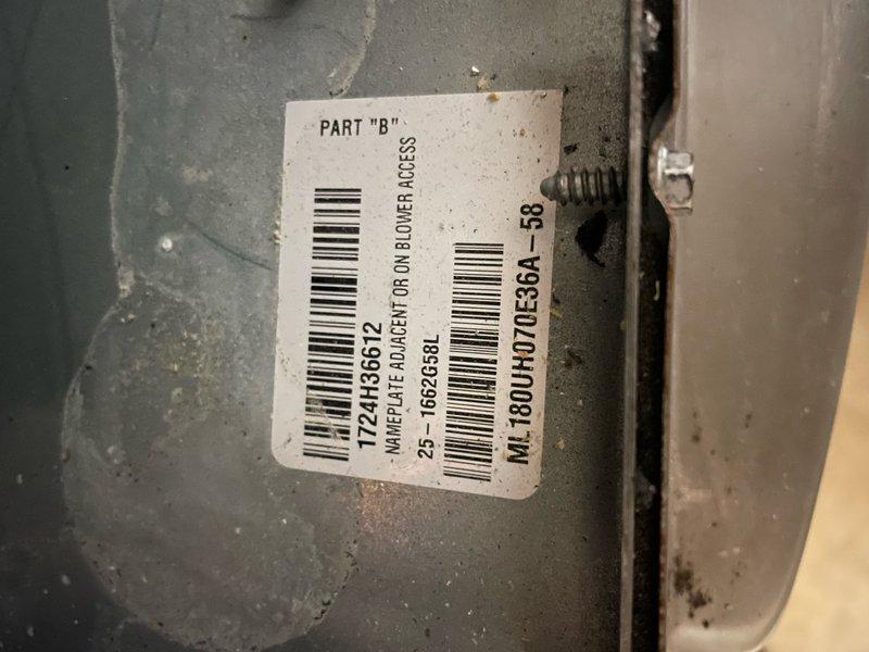 Responded to complaint of hot and humid conditions on upper level with possible short cycling and inadequate airflow from multiple supply vents. Inspected basement-mounted air handler unit, less than two years old. Measured condensate drain pan for proper drainage and verified unit model number M1 180UHF070336A-58. System evaluated for airflow distribution issues and cycling concerns to address comfort problems in conditioned space.