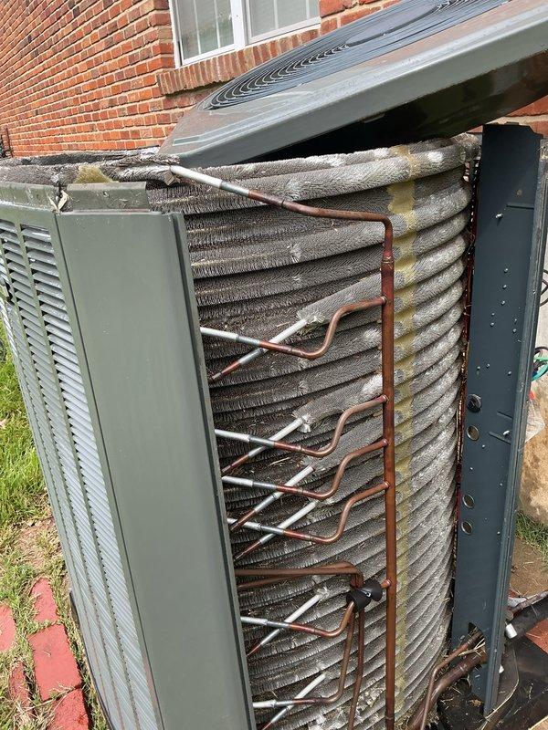 Completed preventive maintenance inspection on 6-year-old cooling unit located on basement pad. Inspected evaporator coil and found significant accumulation of dirt, dust, and debris throughout the fin surfaces, along with oxidation and discoloration compromising heat exchange efficiency. Cleaned condenser coil, checked refrigerant levels, tested electrical components, and verified system operation. Discussed service contract renewal options with customer for continued maintenance coverage.