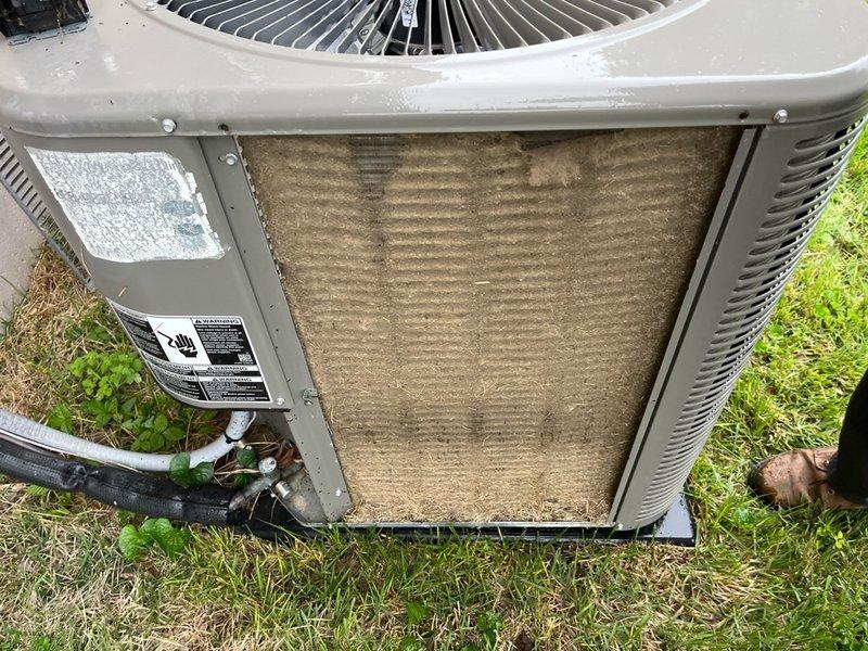 # No Cooling - Lennox AC Unit

Responded to no cooling call on 4-year-old Lennox air conditioning system. Upon arrival, confirmed unit was not operating. Conducted visual inspection of outdoor condenser unit and discovered severely clogged condenser coils with heavy accumulation of dirt, dust, and debris restricting airflow. Additionally found dirty air filter with significant particulate buildup affecting system performance.

Removed and cleaned condenser coils to restore proper heat exchange capacity. Replaced dirty air filter with new filter. Verified proper refrigerant line connections and electrical connections at outdoor unit. Cycled system on and confirmed unit now operating properly with adequate airflow across coils and proper cooling output. Advised ongoing maintenance schedule to prevent future airflow restrictions.