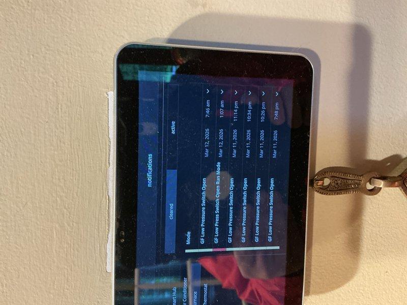 Responded to callback for error message appearing after recent tune-up. Upon arrival, investigated HVAC system and reviewed system diagnostics on wall-mounted thermostat/control interface, which displayed multiple "GE Evo Pressure Switch Open" fault notifications. Inspected unit and discovered accumulated debris and deteriorated organic material near equipment, which may have contributed to airflow restrictions or pressure switch malfunction. Cleared debris, verified pressure switch operation, and reset system errors. Unit returned to normal operation with no active fault codes.