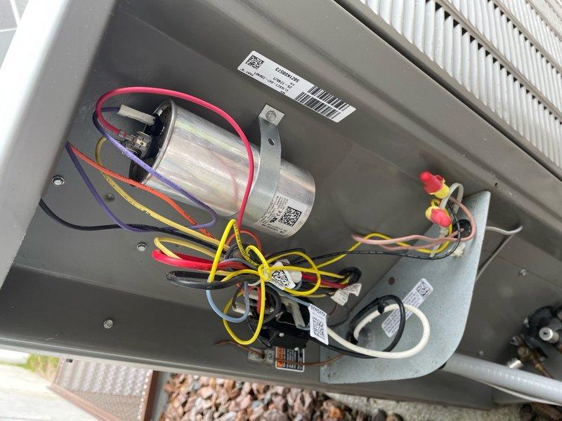 Performed comprehensive cooling maintenance tune-up on residential air conditioning system. Completed full system inspection including electrical components, capacitor connections, and condenser unit internal components. Verified all wire connections secure, inspected dual capacitor with proper wire terminations, and confirmed absence of corrosion or component degradation. Inspected evaporator coil and condenser coil fins for cleanliness and proper airflow. Replaced air filter with new unit to ensure optimal system performance and indoor air quality. Tested system operation and confirmed unit cooling properly with all components functioning within normal parameters.