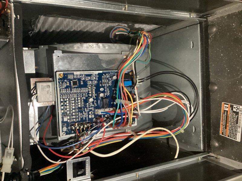 Completed comprehensive cooling system tune-up on outdoor condenser unit located in backyard. Performed full system inspection including electrical controls, circuit board connections, and relay components; cleared debris and vegetation from unit base and surrounding area; verified proper operation of fan assembly and protective grille. All components found to be functioning within normal parameters with no immediate repairs required.