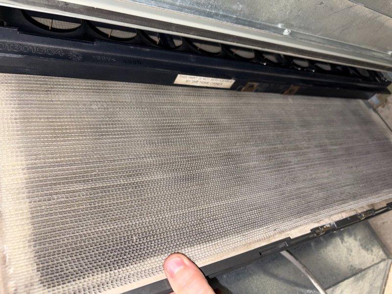 Completed comprehensive air conditioning tune-up service on single outdoor unit for Home Depot customer. Performed standard maintenance protocol including inspection of air filter assembly, which showed moderate dust and debris accumulation in mesh screens, and examined evaporator coil condition. All system components were evaluated and photographed for service documentation, with unit confirmed operational upon completion.