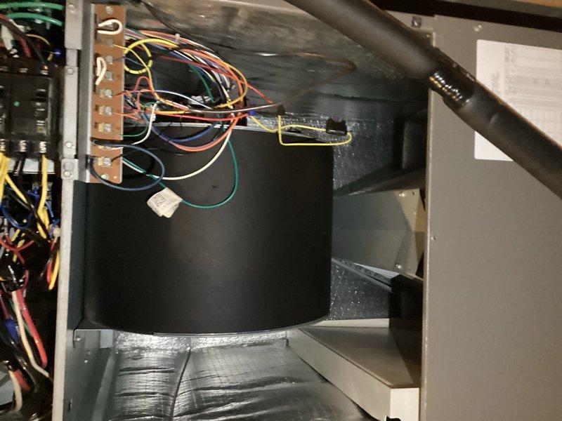 Completed preventive maintenance inspection on a 9-year-old residential air conditioning system. Inspected interior air handler components including blower motor assembly, electrical connections, and control board wiring; all connections found secure and operational. Evaluated outdoor condenser unit, noting weathered exterior panels and accumulated debris on mesh screening; cleaned unit and verified proper refrigerant line connections and electrical terminations remain intact.