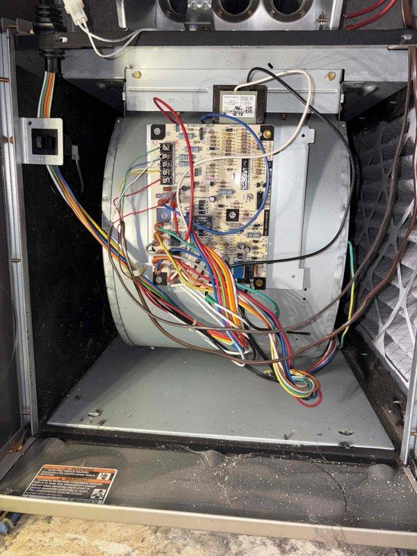 Completed cooling system tune-up on residential air conditioning unit over 10 years old located in side yard. Performed comprehensive system inspection including electrical components, control board, and wiring connections. Inspected and documented MANN+HUMMEL air filter showing normal dust accumulation from use. Verified proper operation of all electrical controls, relays, and safety devices on control board. All components found functioning within normal parameters for unit age.