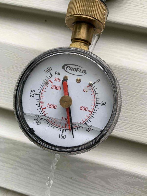 Completed installation of 75-gallon tall gas water heater in basement utility area with proper venting and copper piping connections. Installed 3/4" pressure reducing valve with gauge to regulate incoming water pressure and 1-1/2" full port threaded lead-free ball valve for system isolation. Replaced exterior frost-free hose bib with 10" frost-proof model to prevent freeze damage, completing work that could not be finished during initial water heater installation. All installations performed under permit 26plu-08683 with required plumbing identification stickers applied per code requirements.