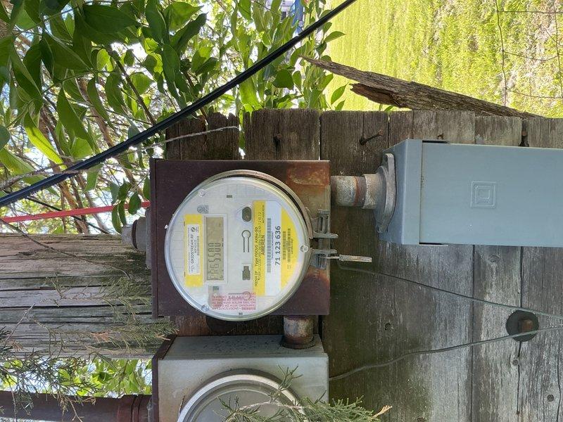 Responded to no-power service call after utility company restored service to the property. Upon arrival, confirmed that power was available at the utility meter but was not reaching the main electrical panel inside the residence. Inspected exterior meter base and service disconnect mounted on weathered wooden fence, verifying utility supply was present and meter was functioning properly. Traced service entrance conductors from exterior disconnect to interior main panel. 

Investigated main electrical panel and found all circuit breakers in normal operating positions with no tripped breakers evident. Performed voltage testing at main panel to diagnose loss of power between utility connection point and distribution panel. Identified failure in service entrance equipment preventing power transfer from meter base to main breaker panel. Examined all service entrance connections, including main lugs and feeder conductors, to locate point of failure in the electrical pathway. Documented exist