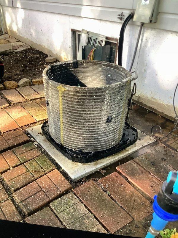 Completed cooling system tune-up on a single outdoor condenser unit over 10 years old located in side yard. Performed comprehensive system inspection including internal control board, electrical connections, capacitor, and blower motor components. Cleaned heavily soiled condenser coil which showed significant dirt and debris accumulation between fins. Verified all electrical connections secure, tested capacitor operation, and confirmed proper system functionality upon completion.