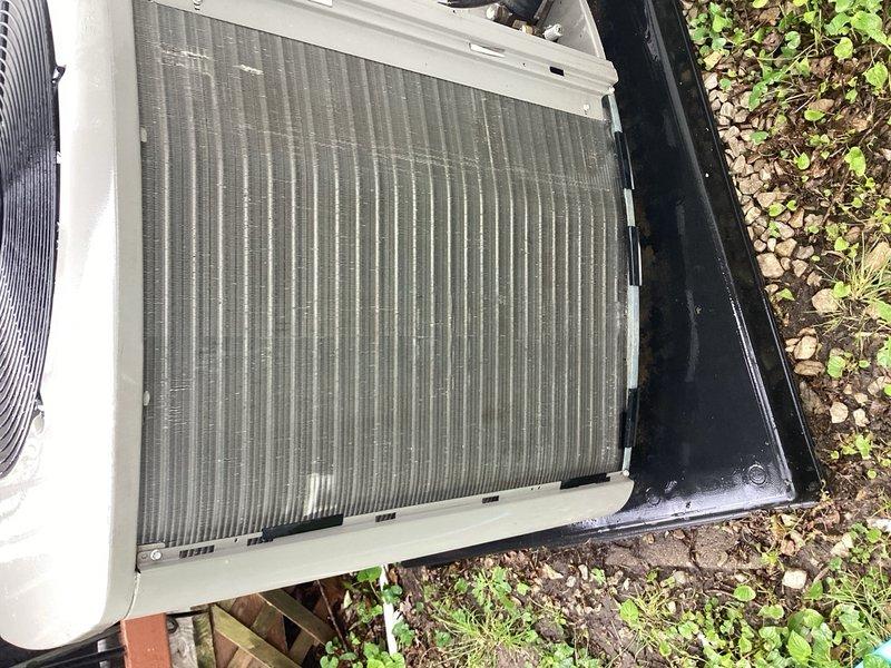 Completed preventive maintenance cooling inspection on a 9-year-old air conditioning system. Performed thorough examination of outdoor condenser unit, noting moderate debris accumulation on coil fins with visible streaking and dust buildup. Inspected electrical control panel and circuit boards, verifying all connections and wiring integrity across multiple control components. All system components found operational with no immediate service needs identified.