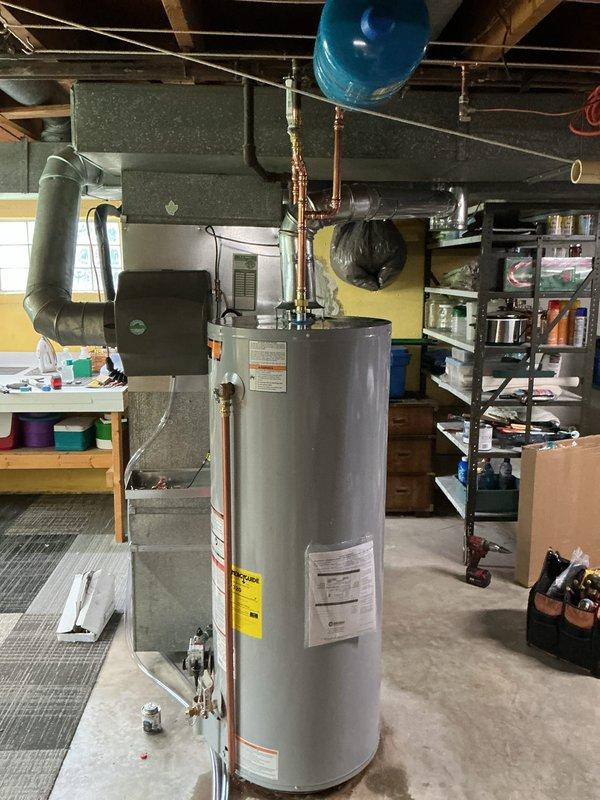 Installed a 50-gallon gas tall water heater in basement utility area with proper copper piping connections, pressure relief valve, and gas line hookup. Verified all plumbing connections for leaks, confirmed proper venting, and ensured unit met City of Florissant code requirements. System tested and operational upon completion.