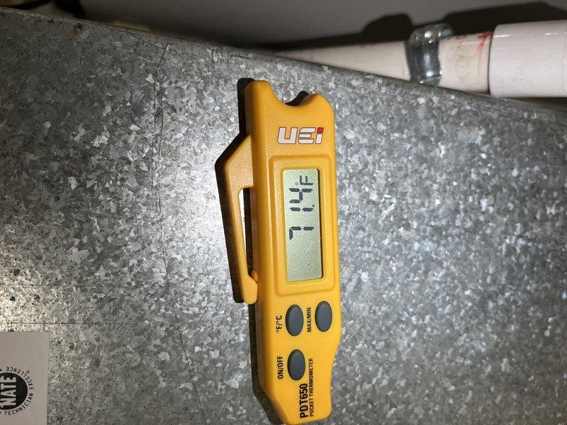 Responded to report of furnace making unusual noise. Performed comprehensive Cooling U10 maintenance inspection on 5-year-old unit located in basement. Conducted temperature diagnostics using digital thermometer, recording 71°F reading at ductwork/insulation area. Performed electrical testing with multimeter to verify system voltage and amperage readings, confirming proper electrical function at 0.5 reading. System operational with no abnormal noises detected at time of service.