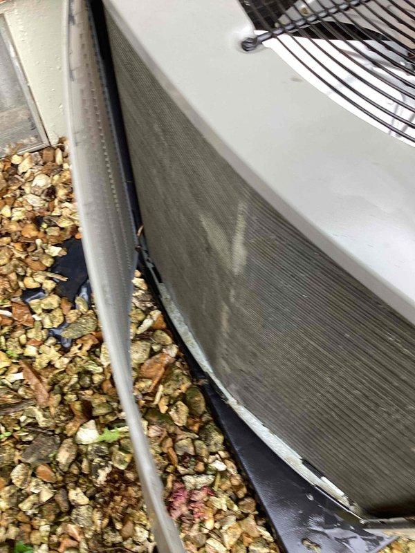Completed comprehensive tune-up service on a 2-year-old residential air conditioning system. Upon arrival, found significant leaf debris and organic matter accumulated around the condenser unit base and along exterior panels. Cleared all debris from around unit perimeter and base to ensure proper airflow and prevent potential obstruction of heat exchange components. Performed standard preventive maintenance inspection of condenser unit, checking refrigerant levels, electrical connections, and overall system operation. Unit tested and operating within normal parameters upon completion.
