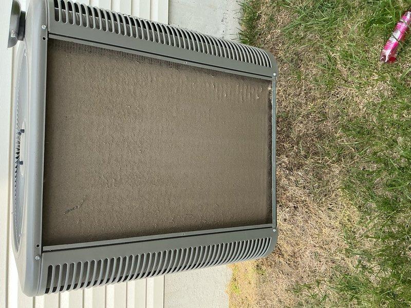 Completed preventive maintenance tune-up on a single residential HVAC system aged 0-5 years. Inspected outdoor condenser unit and noted significant dirt and debris accumulation on exterior filter/screen requiring cleaning. Accessed interior blower assembly and motor compartment, verified electrical connections and wiring harness integrity, and confirmed proper operation of all components. System is functioning correctly following standard maintenance procedures.