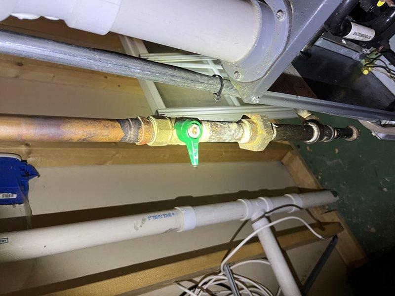 Responded to service call for 10-year-old Amana furnace located in basement with reported cracked heat exchanger identified during prior inspection. Performed thorough visual assessment and confirmed heat exchanger damage requiring replacement. Documented system condition with photographs showing furnace components, ductwork connections, and surrounding mechanical installations for warranty and repair planning purposes.
