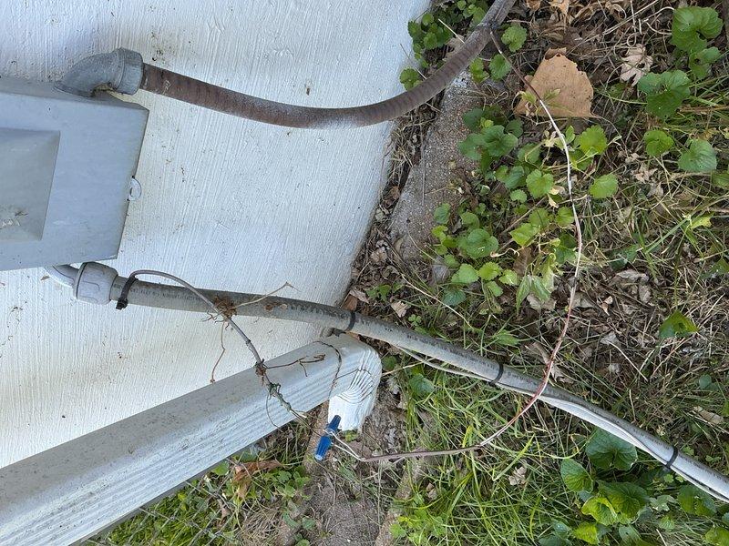 Responded to no-cool call on single outdoor condensing unit located in side yard. Upon arrival, performed system diagnostic and inspection of both indoor and outdoor components. Accessed control board in air handler, verified wiring connections and electrical components. Inspected outdoor unit including refrigerant lines, electrical disconnect, and conduit routing. System evaluated and photos documented for customer records.