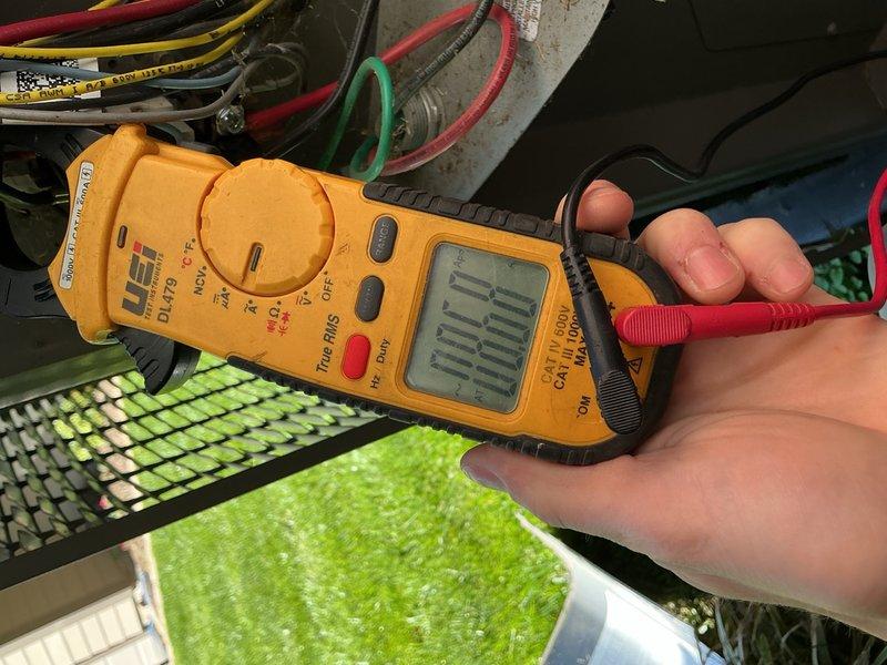 Completed comprehensive cooling maintenance on a 9-year-old air conditioning system. Performed electrical diagnostics using clamp meter to verify proper amperage draw and system performance at the evaporator coil assembly. Removed debris accumulation from outdoor condenser unit top surface and inspected exterior components. System tested and confirmed operational with all parameters within normal range.