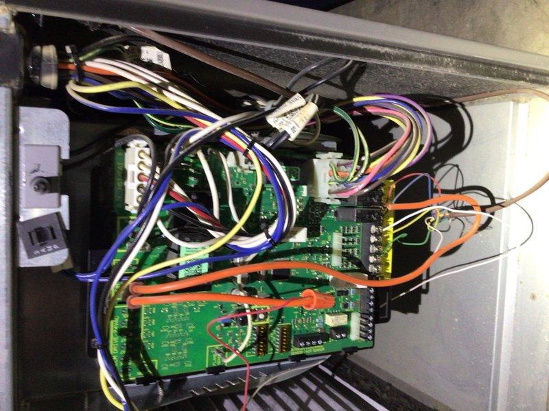 Completed cooling tune-up on 2-year-old outdoor unit. Inspected control board and electrical connections within the system housing, verified proper wiring configuration and component operation. Observed air filter requiring replacement and documented system conditions through photographic documentation for customer records.