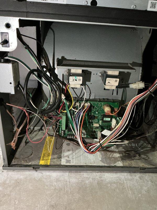Completed comprehensive cooling system tune-up on 7-year-old outdoor unit. Performed standard preventive maintenance protocol including inspection of electrical components and control board, verified proper operation of all system controls, and replaced air filter. Documented system condition through photographs of filter replacement and internal control panel components showing circuit board, transformers, and wiring connections in satisfactory operating condition.