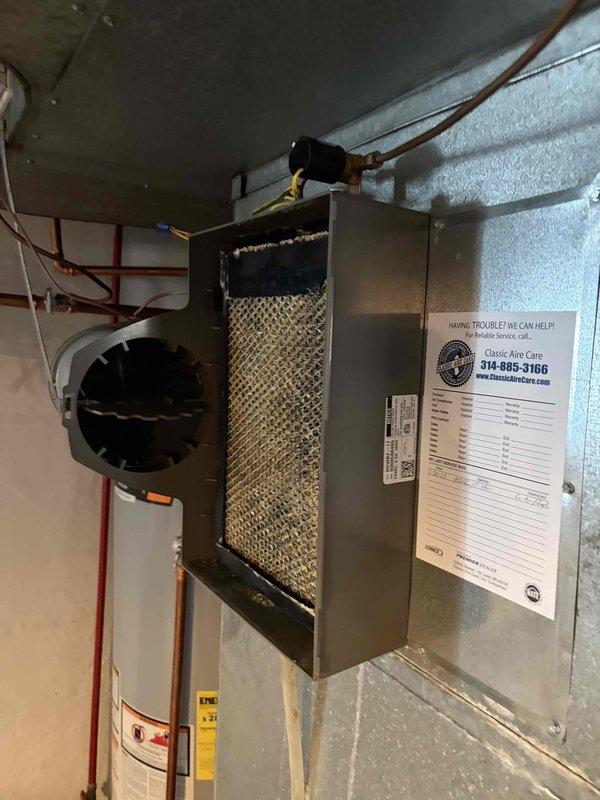 Responded to service call for water leaking in furnace located in basement. Upon arrival, found significant water pooling on concrete floor around HVAC system and air handler unit. Inspected furnace, air handler, and associated components including refrigerant lines and condensate drainage system. Documented existing water damage with visible standing water, mineral deposits, and efflorescence on floor surface. Identified source of water intrusion and assessed condition of equipment including water heater and HVAC infrastructure in utility area.