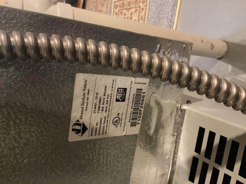 Responded to service call for air conditioning unit freezing up. Upon arrival, inspected 10-year-old outdoor condensing unit located on side of home and evaluated indoor air handler components. Examined thermostat operation and settings to verify system controls were functioning properly. Inspected flexible ductwork connections and air distribution system for proper airflow. Assessed refrigerant lines, evaporator coil access points, and ventilation components for signs of restricted airflow or improper operation that could cause freezing conditions. Documented system conditions with photographs of thermostat control panel and ductwork installation. Identified potential causes of freeze-up including airflow restrictions, refrigerant issues, or thermostat malfunction requiring further diagnosis and repair.