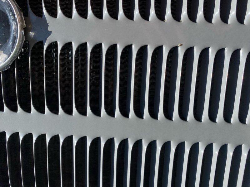 Completed cooling maintenance tune-up on 3-year-old Rheem air conditioning system. During inspection, discovered heavy frost and ice buildup on evaporator coil fins, indicating restricted airflow or potential refrigerant issue. Cleaned condenser coils, checked refrigerant levels, inspected electrical connections, and verified proper system operation. System restored to normal working condition with improved heat transfer efficiency across coil surfaces.