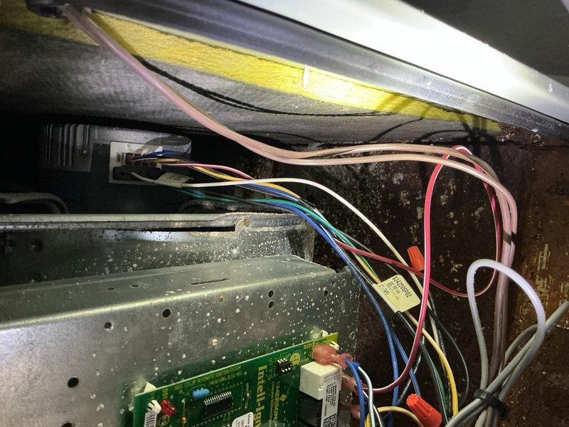 Completed comprehensive cooling tune-up maintenance on two 9-year-old outdoor AC units. During inspection, discovered significant rust and corrosion on base pan and interior metal surfaces of one unit, along with dust accumulation on control board and electrical connections. Performed standard maintenance procedures including cleaning condenser coils, checking refrigerant levels, testing electrical components, and inspecting all wiring connections. Documented equipment condition with photos showing corroded base pan and control board area for customer records and future service reference.