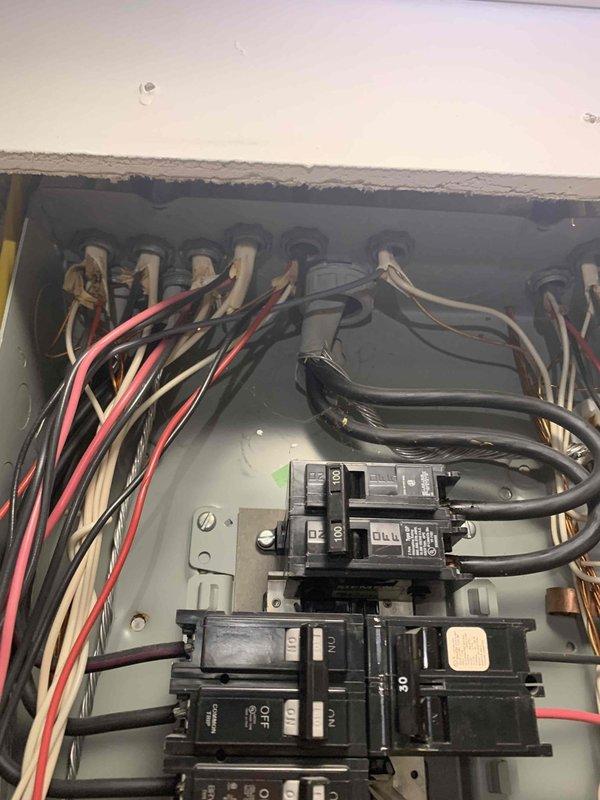 Responded to electrical emergency where plugging a microwave into one receptacle caused sparking at a different outlet, indicating a potential circuit fault or wiring issue. Performed comprehensive electrical panel inspection, documented breaker configuration and wiring conditions, and assessed circuit integrity to identify the source of the hazardous sparking condition.