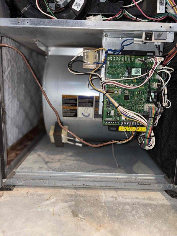 # Summary

Completed preventative maintenance tune-up on a 2012 single-stage air conditioning system, identifying damaged condenser coil fins that may impact heat transfer efficiency but unit remains operational.

# Work Performed

Performed comprehensive cooling season tune-up on outdoor condensing unit. Conducted visual inspection of all accessible components including condenser coil, control boards, and electrical connections. 

Inspected condenser coil and documented moderate fin damage in lower right section where aluminum fins are bent and compressed, reducing airflow through approximately 15-20% of coil surface area. Damage pattern suggests impact from lawn equipment or debris. Remaining coil sections maintain proper fin spacing and appear relatively clean.

Examined control board compartment and verified all electrical connections are secure. Multiple circuit boards with control modules show no signs of overheating, corrosion, or component failure. Wiring harnesses properly rou