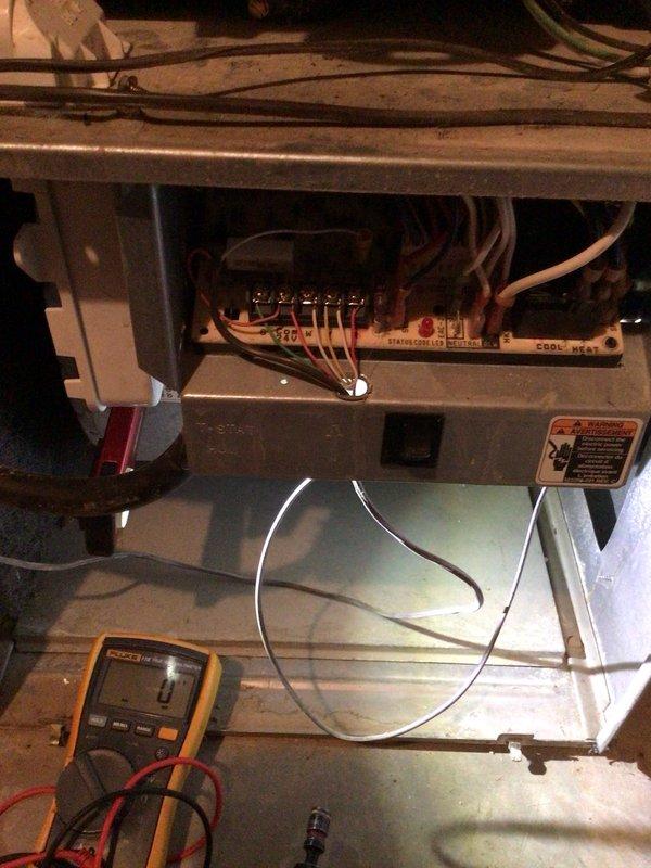 Completed comprehensive cooling system tune-up on 14-year-old AC unit located on elevated exterior slope, requiring ladder access for safe servicing. Performed standard maintenance protocol including filter inspection, electrical system diagnostics with multimeter testing of control board connections and voltage levels, and thorough examination of blower compartment components. All systems evaluated and found operating within normal parameters upon completion of preventive maintenance service.
