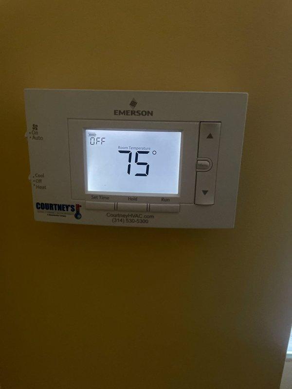 Completed comprehensive cooling system maintenance on an 18-year-old GE air conditioning unit. Performed standard AC tune-up procedures including inspection of all major components, cleaning of condenser coils, verification of refrigerant levels, and testing of electrical connections. Verified Emerson programmable thermostat operation, confirming proper communication between thermostat and cooling system with accurate temperature readings at 75°F and setpoint functionality. All systems tested and operating within normal parameters upon completion of preventive maintenance service.
