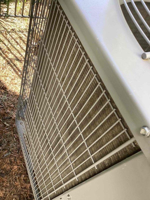 Completed comprehensive cooling system tune-up on outdoor condenser unit over 10 years old located in side yard. Performed standard maintenance protocol including inspection of condenser coils, grille assembly, and exterior housing—all components found to be in good working condition with no visible damage, debris accumulation, or deterioration. Unit operational and ready for continued service.