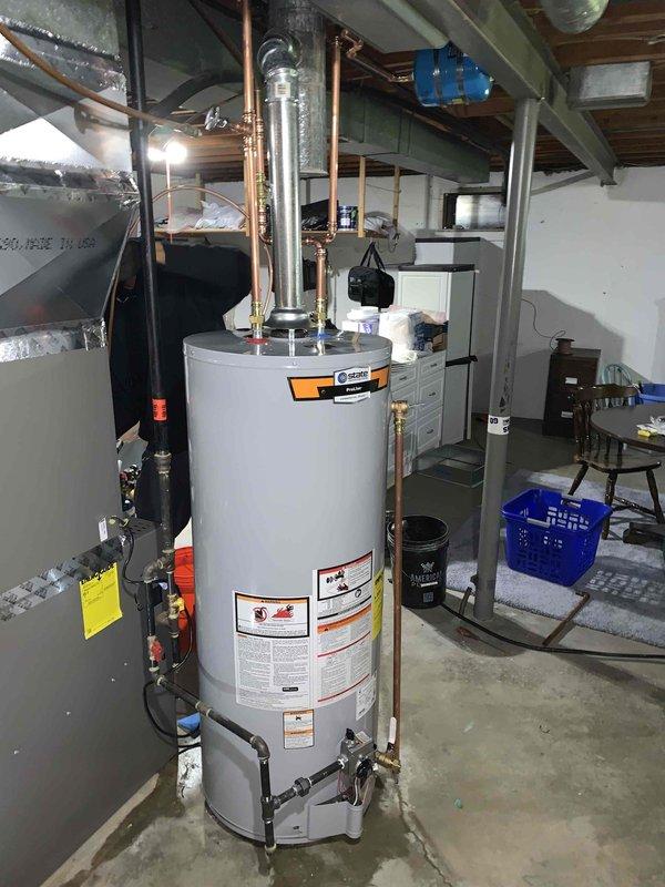 # Tanked Water Heater Installation

Successfully completed installation of a new residential tanked water heater in basement utility area. Removed existing unit and installed replacement water heater with proper plumbing connections, including copper supply lines, shut-off valves, and temperature and pressure relief valve piping. Installed expansion tank to accommodate thermal expansion in closed plumbing system. Connected all hot and cold water distribution lines with appropriate fittings and unions for future serviceability. Verified all connections for proper seal and tested system for leaks. Ensured adequate clearance from adjacent HVAC equipment and combustibles per manufacturer specifications and local code requirements. System was filled, purged of air, and brought to operating temperature. Verified proper operation of all safety devices and control systems. Installation completed in compliance with applicable plumbing codes. No permit or inspection sticker required per City of 