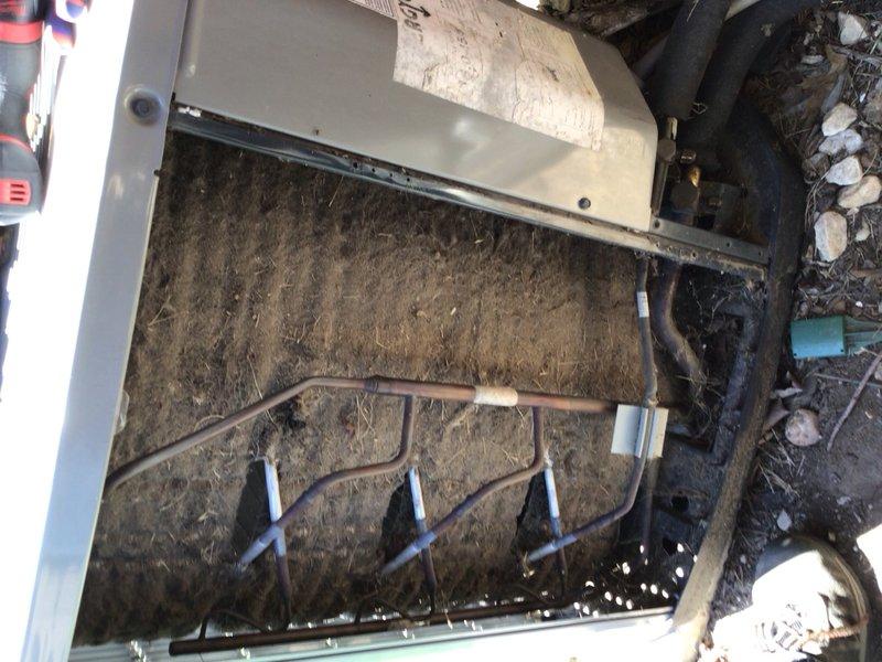 # HVAC Cooling System Tune-Up - Single Unit

## Work Performed

Completed comprehensive preventive maintenance service on residential air conditioning unit located in backyard. Upon initial inspection, discovered evaporator coil assembly heavily contaminated with accumulated dirt, dust, and debris, exhibiting dark matted buildup that significantly restricted airflow and heat transfer efficiency.

Removed top access panel to access internal components. Thoroughly cleaned evaporator coil fins using appropriate cleaning solutions and techniques to restore proper airflow. Addressed heavy contamination on coil surfaces that had accumulated over extended period without maintenance. Cleaned copper refrigerant lines and verified proper mounting bracket security along tube routing.

Inspected all accessible components including:
- Evaporator coil fin condition and cleanliness
- Copper refrigerant tubing for signs of wear or damage
- Mounting clips and brackets for secure positioning
- Unit hous