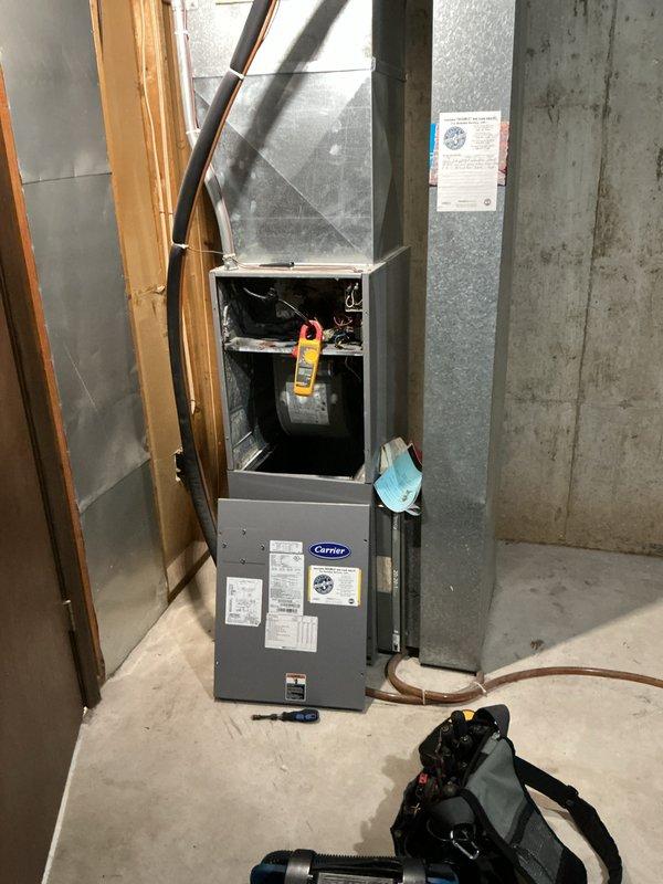Completed comprehensive Supertune maintenance on two HVAC units at property coordinated through realtor. Performed full system diagnostics on Carrier air handler unit located in basement and outdoor AC condenser unit in backyard, both approximately 10 years old. Conducted electrical testing with multimeter, inspected blower motor assembly and internal components, checked all wiring connections, and verified proper operation of both heating and cooling systems. Replaced 20x20 air filter showing moderate dust accumulation. All systems tested and operating within normal parameters upon completion.