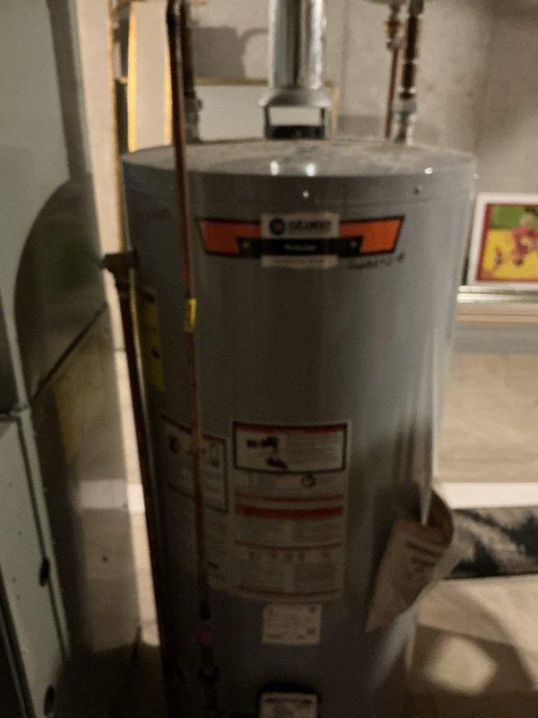 Successfully installed a 75-gallon tall gas water heater in residential utility space. Connected copper supply and discharge piping to building plumbing system, ensured proper venting, and verified all connections for leaks. Applied plumbing identification sticker and completed installation under permit #26PLU-09624. Unit tested and confirmed operational.
