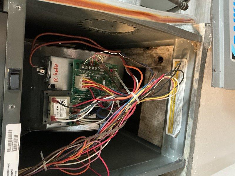 Completed cooling system tune-up on a 9-year-old ground-level AC unit. Performed comprehensive inspection of control board and electrical connections, verified all wiring harnesses and terminals were secure, and inspected the air filter which showed moderate dust accumulation consistent with normal operation. All components were found to be functioning properly with no immediate service needs identified.