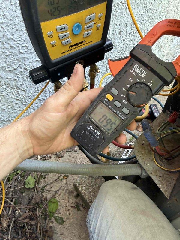 Completed annual air conditioning tune-up on a 2005 Trane system. Performed comprehensive inspection of blower motor assembly, verified electrical connections, and tested refrigerant lines. Measured amperage draw at 0.94 amps using clamp meter and confirmed system temperatures within normal operating parameters. Cleaned accessible components, inspected air handler unit, and verified proper system operation upon completion.