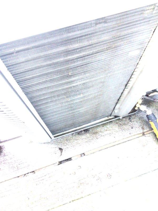 Completed comprehensive cooling season tune-up on 8-year-old residential air conditioning system. Performed standard maintenance protocol including condenser coil inspection, refrigerant level verification, electrical connection testing, and airflow assessment. Unit operational and ready for cooling season, with condenser showing normal weathering consistent with outdoor exposure.