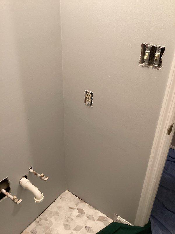 Completed electrical estimate for bathroom remodeling project involving relocation of existing outlet and installation of GFCI protection. Assessed current electrical configuration with exposed switch and outlet boxes, documented existing wiring conditions, and provided specifications for code-compliant GFCI outlet installation to meet bathroom safety requirements.