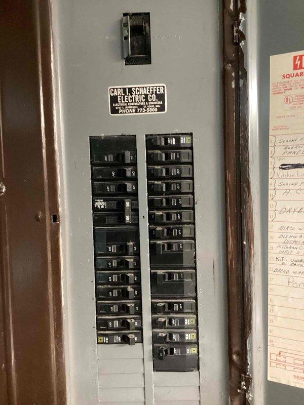 Completed comprehensive electrical maintenance audit of residential service panel. Inspected main breaker panel containing dual columns of circuit breakers, verified proper labeling of circuits including receptacle body and heater circuits, and documented panel condition with interior and exterior views. All breakers operational, conduit connections secure, and panel housing structurally sound with no immediate safety concerns identified.