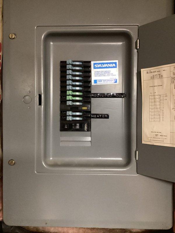 Completed comprehensive electrical maintenance audit of residential service panel. Inspected main breaker panel containing dual columns of circuit breakers, verified proper labeling of circuits including receptacle body and heater circuits, and documented panel condition with interior and exterior views. All breakers operational, conduit connections secure, and panel housing structurally sound with no immediate safety concerns identified.