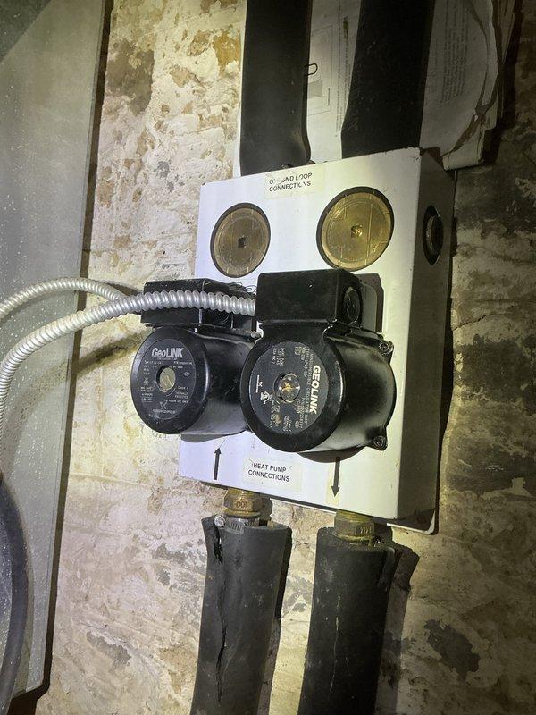 Completed preventive maintenance tune-up on a 20-year-old cooling system located in the basement. Performed comprehensive inspection of hydronic heating/cooling components including circulation pumps, flow indicators, pressure gauges, and associated piping connections. All system components found operating within normal parameters; documented equipment condition with photos for service records.