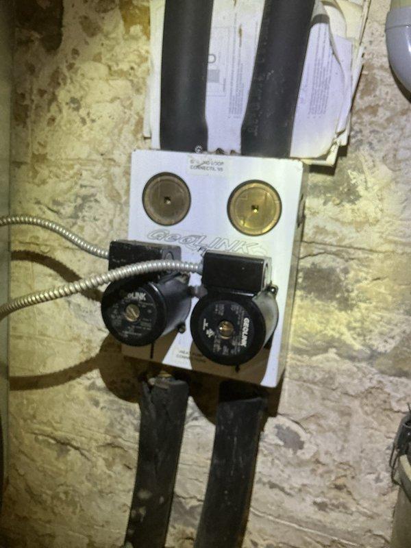 Completed preventive maintenance tune-up on a 20-year-old cooling system located in the basement. Performed comprehensive inspection of hydronic heating/cooling components including circulation pumps, flow indicators, pressure gauges, and associated piping connections. All system components found operating within normal parameters; documented equipment condition with photos for service records.