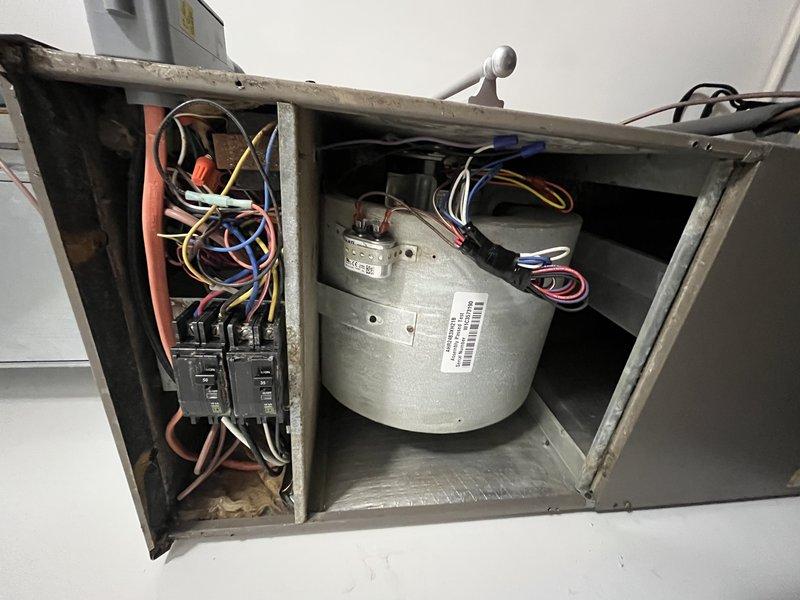 Responded to no cooling call for commercial property with 13-year-old Coleman unit blowing warm air throughout building. Upon inspection, found evaporator coil heavily restricted with dust, lint, and debris accumulation, severely limiting airflow and heat transfer capacity. Accessed blower compartment and electrical components, which showed signs of age and dust buildup. Cleaned evaporator coil thoroughly to restore proper airflow, inspected blower motor and electrical connections for proper operation, and verified all contactors and circuit breakers functioning correctly. System restored to normal cooling operation with adequate airflow and temperature differential. Recommended regular filter changes and periodic coil cleaning to prevent future airflow restrictions.