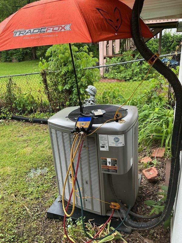 Responded to no-cool call on residential split system less than 10 years old. Upon arrival, found evaporator coil completely frozen with severe ice buildup throughout the indoor unit. Diagnosed restricted airflow as primary cause of freezing condition. Shut down system to allow complete defrost of coil. Inspected outdoor condensing unit and verified proper operation of compressor and condenser fan. Checked refrigerant lines and connections for proper insulation and signs of restriction. System unable to maintain setpoint temperature due to ice blockage preventing proper heat exchange. Allowed adequate defrost time before further diagnostics to determine underlying cause of airflow restriction, which may include dirty filter, blocked return air, low refrigerant charge, or blower motor issues requiring follow-up service.