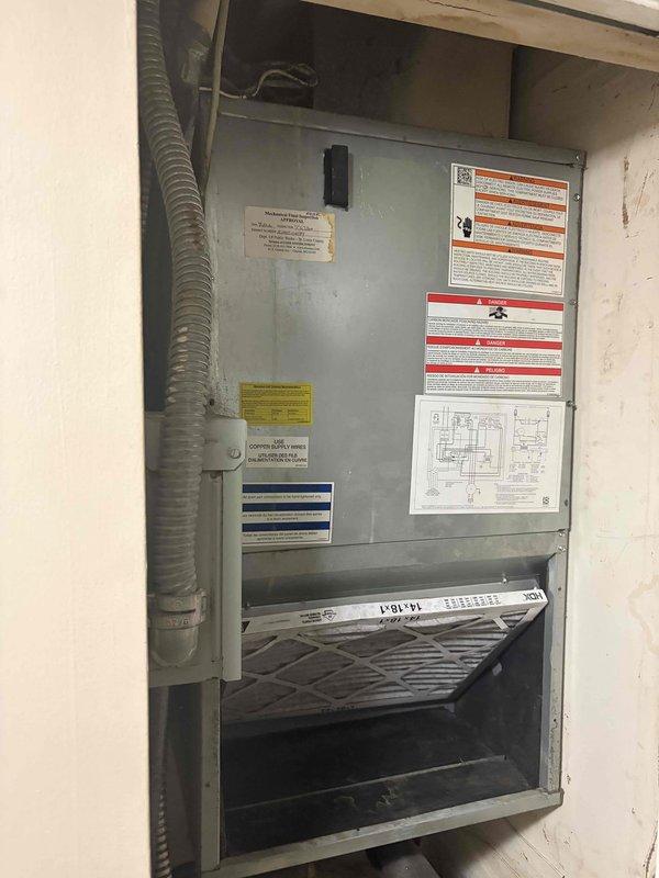 # HVAC Service Completed

Responded to service call for furnace leaking when air conditioning system operates. Upon arrival, inspected 10-year-old air handler unit located in first-floor utility closet. Found evidence of significant water damage to ceiling above unit, with peeling paint and exposed substrate indicating ongoing moisture intrusion. 

Investigation revealed condensate drainage issue from air handler causing water to overflow and damage surrounding structure. Inspected condensate drain line, drain pan, and associated plumbing connections. Cleared blockage in condensate line that was preventing proper drainage during cooling operation. Verified drain pan integrity and confirmed proper pitch for water flow.

Tested system operation in cooling mode to ensure condensate drains properly without overflow. Monitored unit through complete cooling cycle to verify repair effectiveness. Checked air filter condition and confirmed adequate airflow through system. Documented existing ce